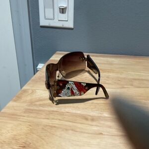 Stylish Sunglasses with Red and Gold Accents